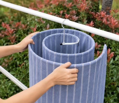 Percha espiral en uso con una sábana colgada secándose
